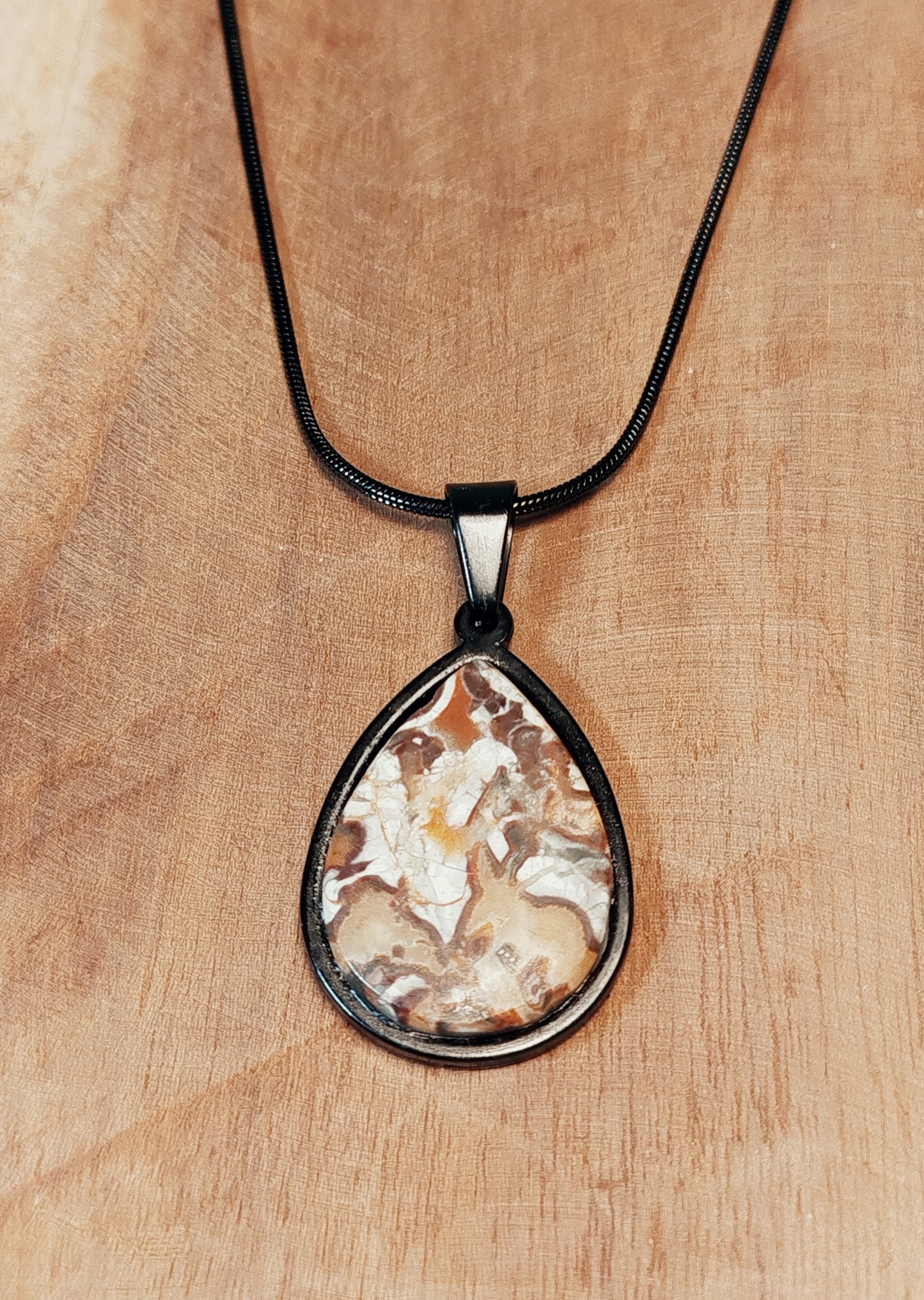 Pendentif acier et Agate money